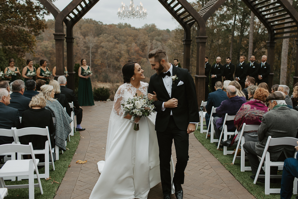 Couple walking down the aisle at a wedding