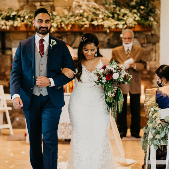 Couple walking down an aisle