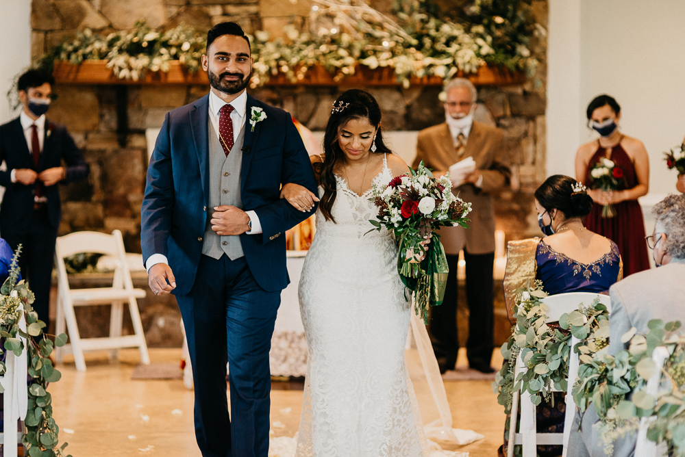 Couple walking down an aisle